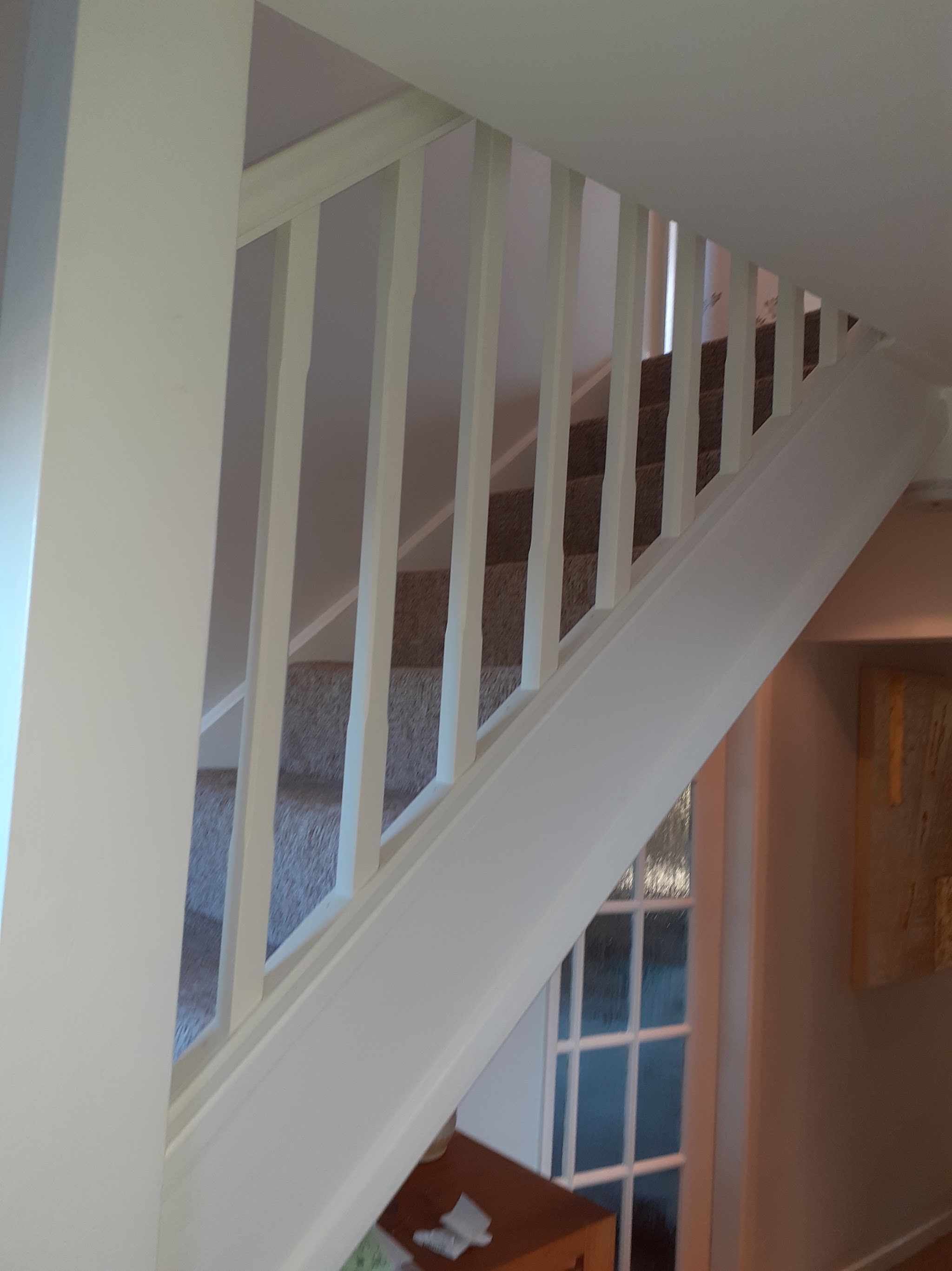 Painted staircase spindles and handrail